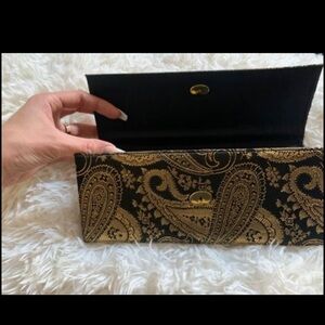 Vintage black and gold clutch bag with gold paisley pattern and gold hardware